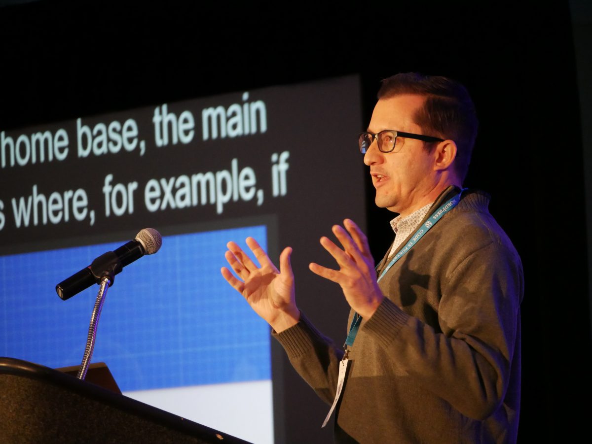 Speaker at the podium at WordCamp US 2019