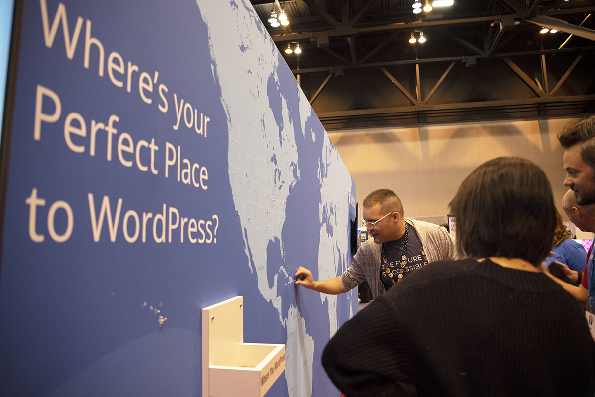 David Wolfpaw places a pin in a world map that says "Where's your perfect place to WordPress?"