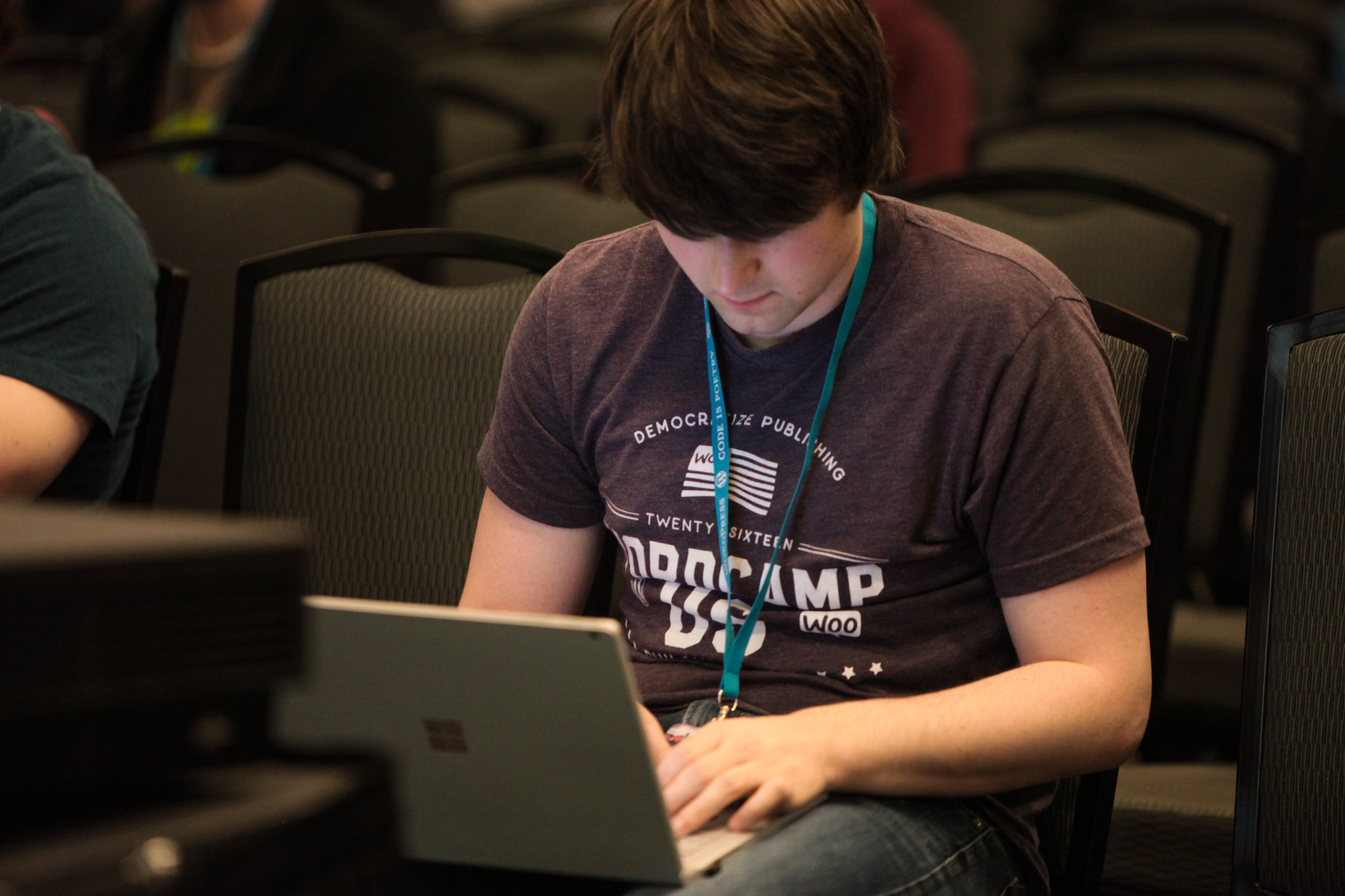 A person with a laptop at WCUS 2017