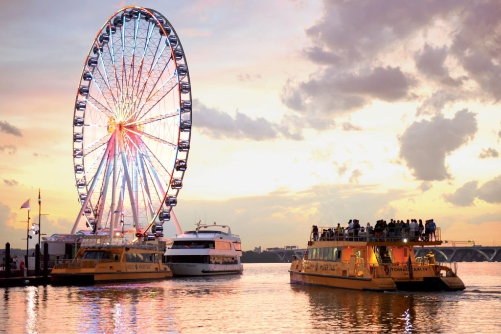 Capital Wheel with water taxis at sunset. Photo courtesy of the Gaylord National Resort and Convention Center.
