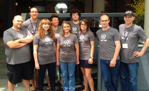 Kim Parsell stands among members of the WP Docs team.